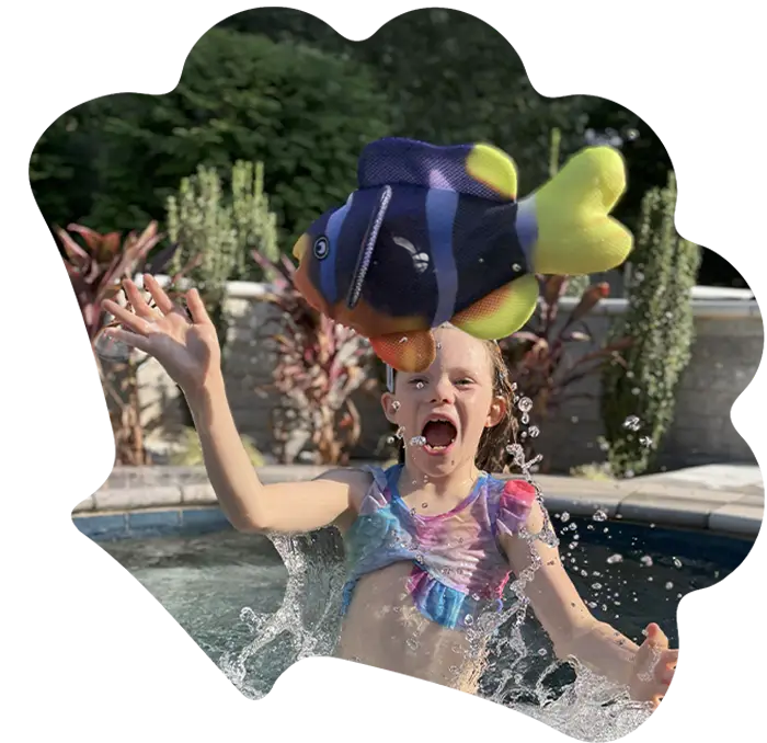 Little girl throwing a fish in the air